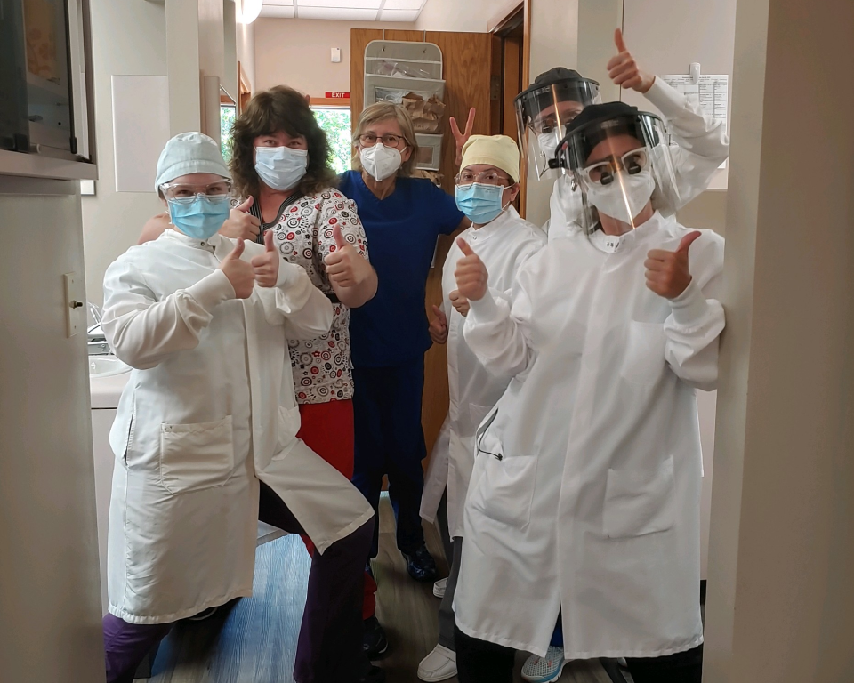 Silly image of the team in scrubs and masks